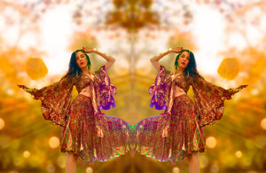 Bohemian paisley print matching set with a flowy tie-front top and skirt, styled with mirrored symmetry for a modern hippie aesthetic. Perfect for vintage-inspired fashion lovers and free-spirited autumn looks.